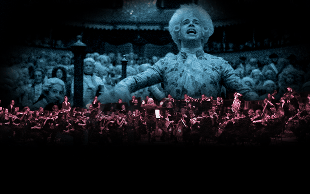 The orchestra of Opera North performing in front of the film Amadeus