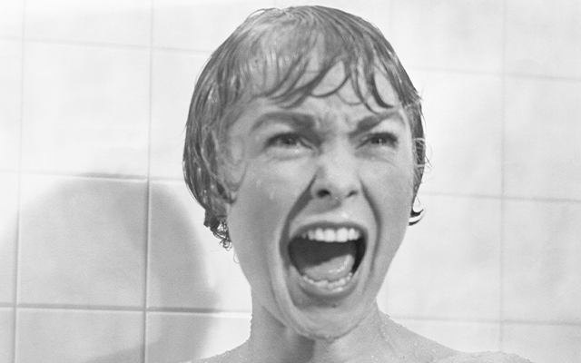 An iconic still from the film Psycho of Marion in the shower scene screaming