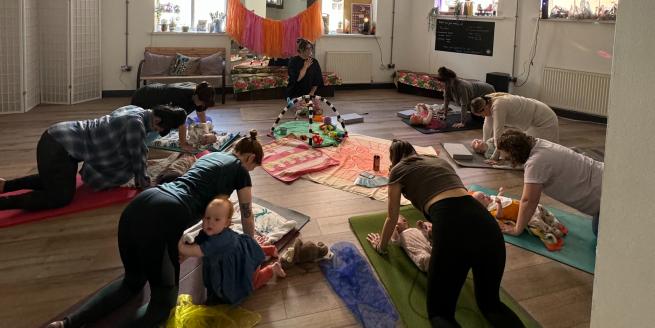 A parent and baby yoga class at Yoga Hero