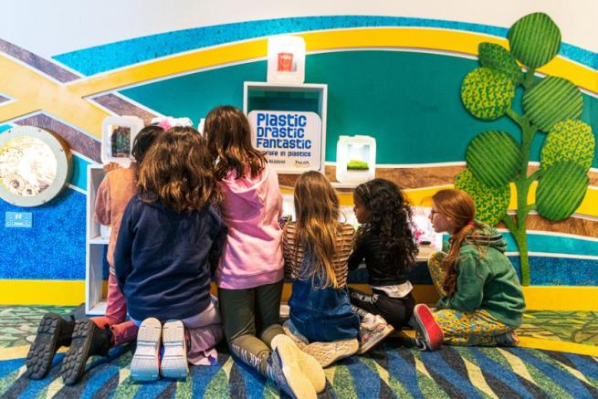 A group of children taking part in an interactive workshop.