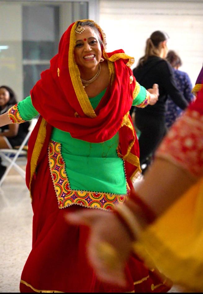 Person dancing dressed in South Asian clothing 