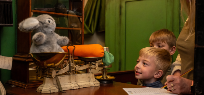 Children looking at display at Abbey House Museum