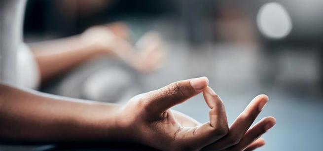 A picture of a hand of someone meditating