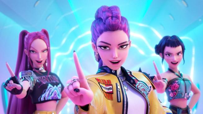 Three woman with colourful, stylish outfits, one hand raised with index finger pointing up.