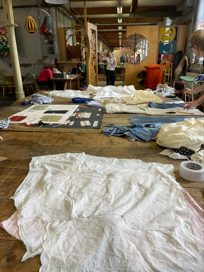a table with fabric and patterns