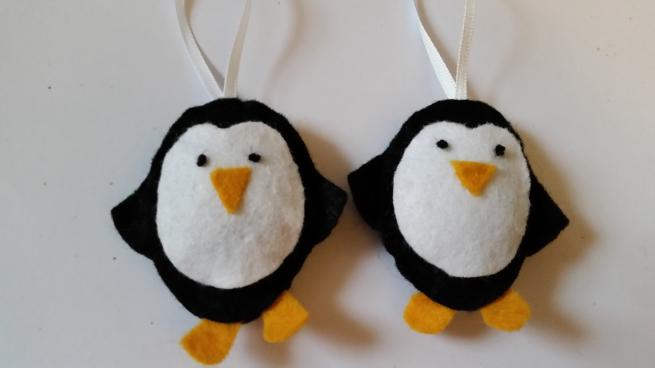 An image of two felt penguins