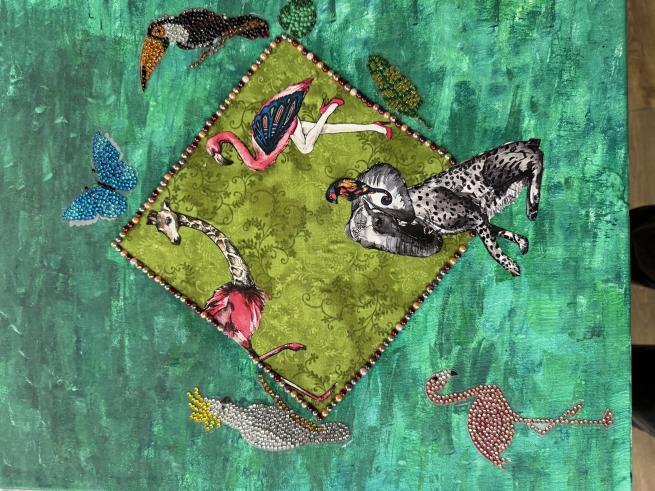 Image of painting and collage including a green background with birds and fish images stuck on 