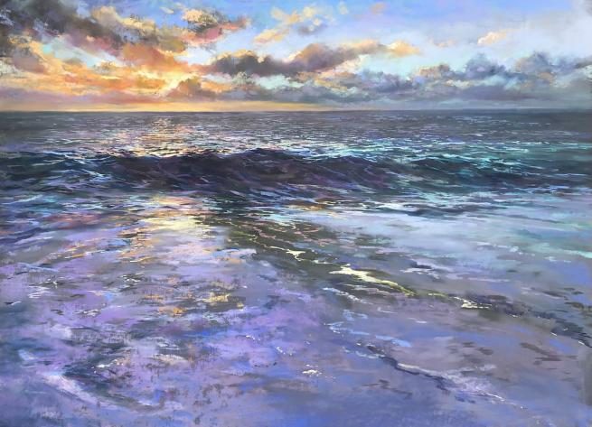 Beautiful seascape of the sun setting over the sea in cornwall