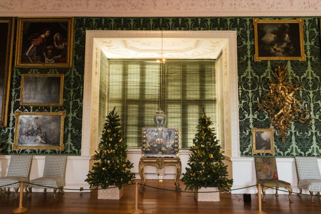 Photograph of inside of Temple Newsam with two small decorated Christmas trees