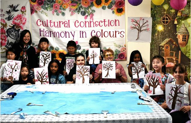 Group photo by the end of a Cultural Connection Art Workshop