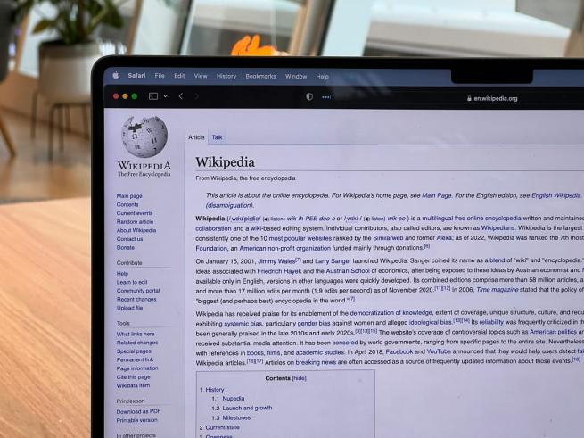 Photo of a laptop opened to a Wikipedia page
