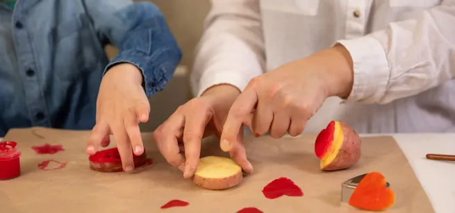 people cutting vegetables and fruit