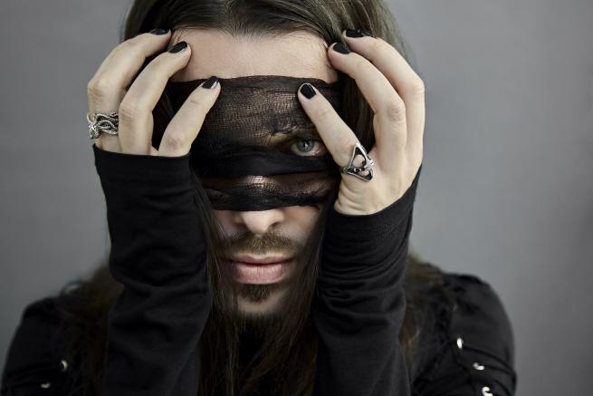 Headshot of David Lawrie of The Royal Ritual, posing in gothic attire