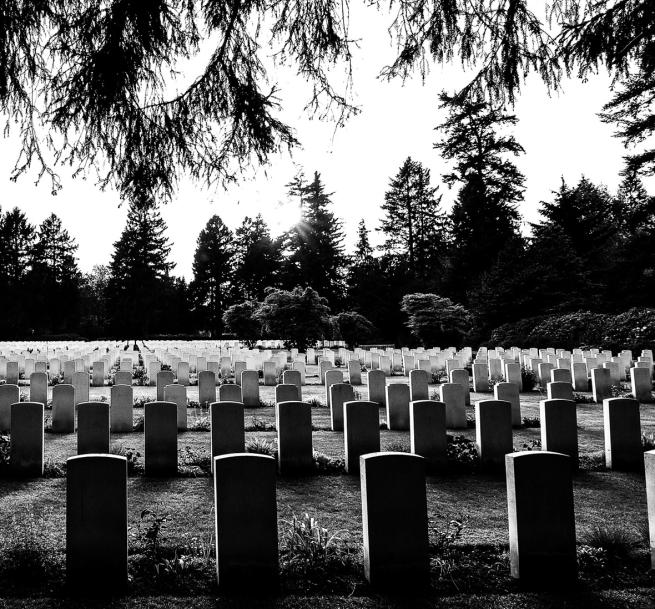 A black and white image of a cemetery