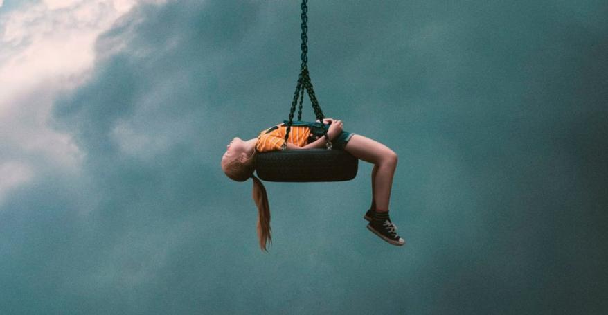 a child being winched up in the sky