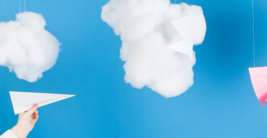 cotton wool clouds and paper airplanes