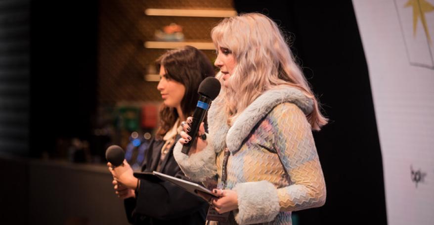 two women on stage speaking