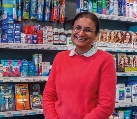 women standing in front of a shop aisle