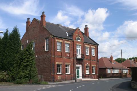 A picture of the red bricked Oulton Institute hall.