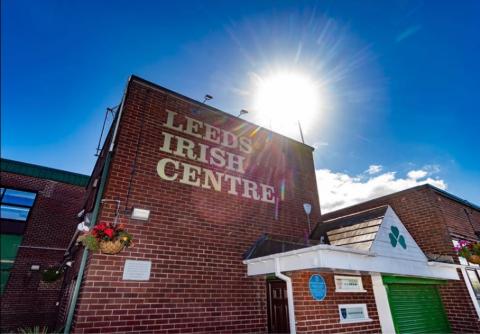 Angled close up picture of Main Entrance door and sign reading Leeds Irish Centre