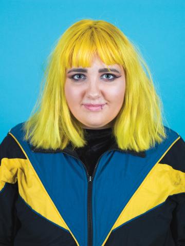 A young woman with bright yellow hair