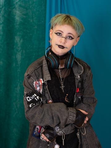 a young woman in black with black lipstick