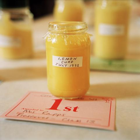 a jar of lemon curd with first prize certificate