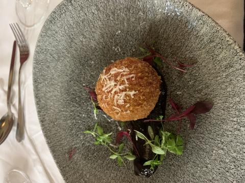 The tasting menu includes arancini with goats cheese