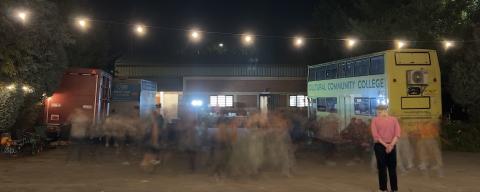 A blurred group of people dancing