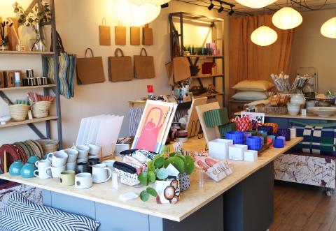 image shows the inside of stocked. with prints, plants and items made by local makers