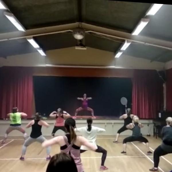A picture of the participants taking part in a Zumba class with Claire.