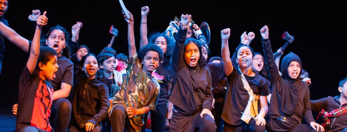 Young people in a group on stage
