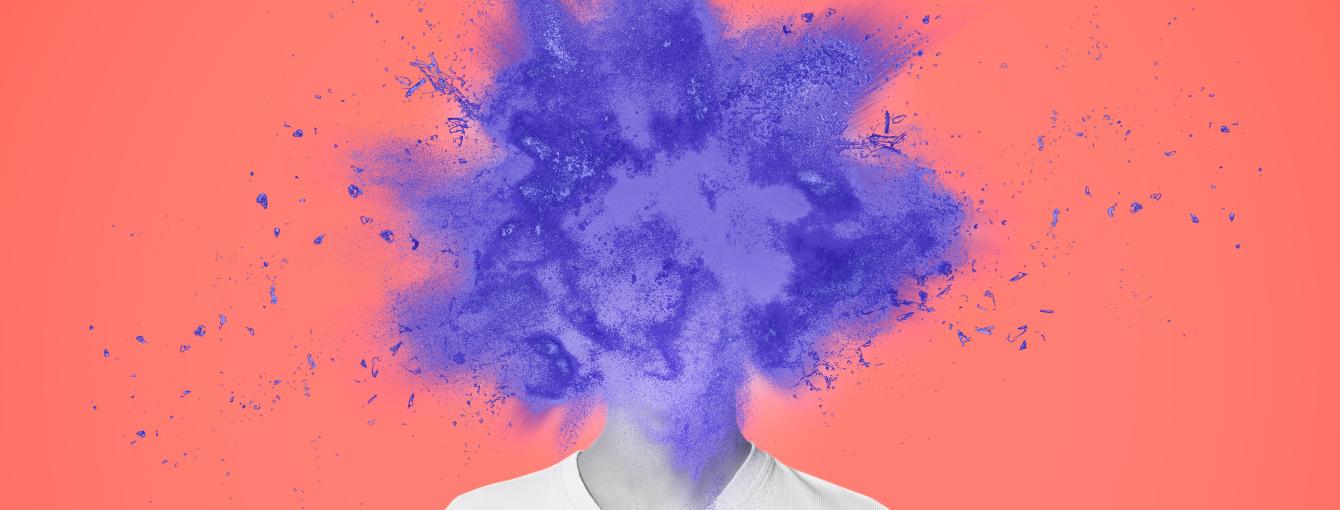A purple paint explosion in the place of a head. Below, a neck and a white t-shirt. The background is pink/orange.